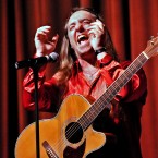 Licks and Laughs: Comedian Phil Johnson tickles crowds with his jocular jams.