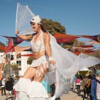 ISLAND MUSIC: A stilt-walking performer at TIMF 2013. The festival will relocate after 10 years on Treasure Island. Photo by Ignacio Lopez.