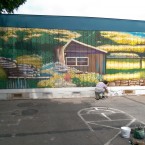 MURAL MAESTRO: Local artist Micah Alfaro paints his newest mural to the tune of live music, drinks, and revelry at Station X Salon in Campbell.