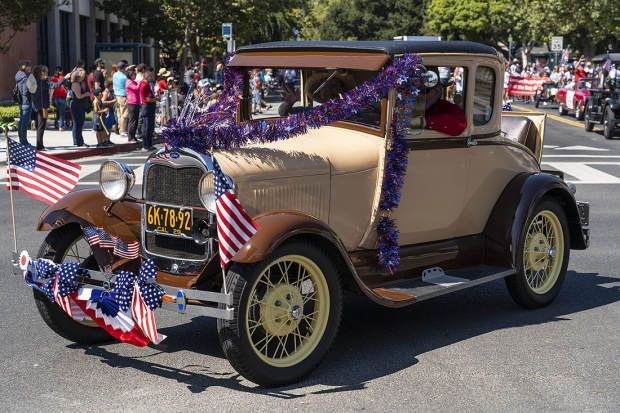 ROSY OUTLOOK: Classic cars, bike decoration, and a whole lot more at 'Rose, White & Blue.'